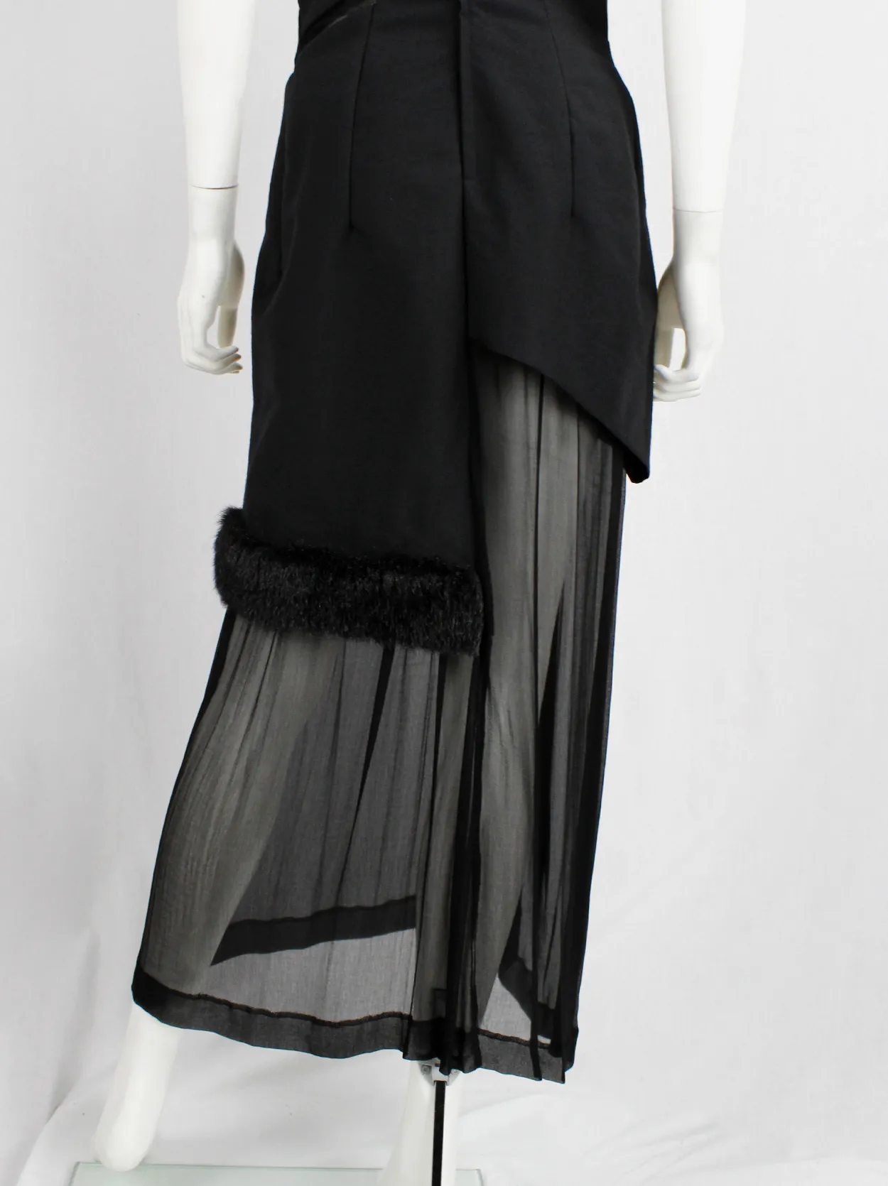 Comme des Garçons black panelled dress with faux fur trim on a sheer underlayer — fall 1997