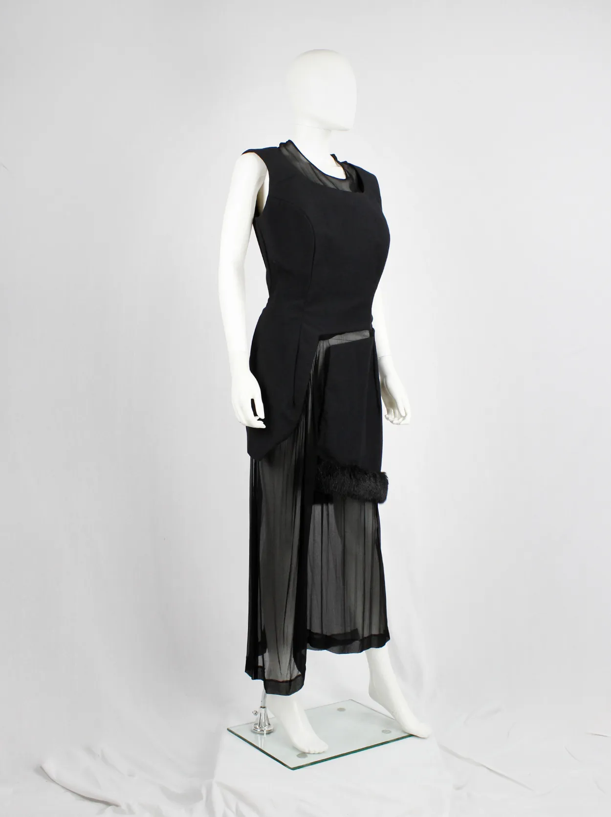 Comme des Garçons black panelled dress with faux fur trim on a sheer underlayer — fall 1997