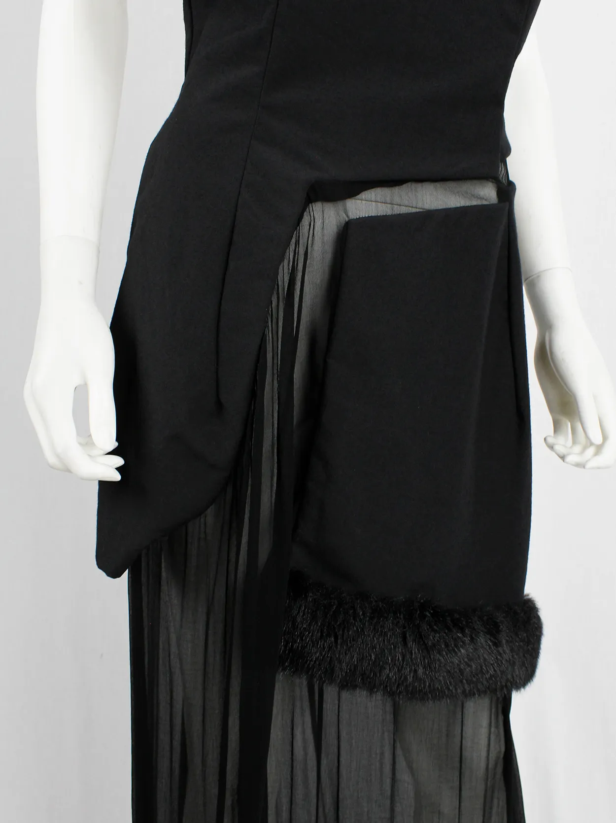 Comme des Garçons black panelled dress with faux fur trim on a sheer underlayer — fall 1997