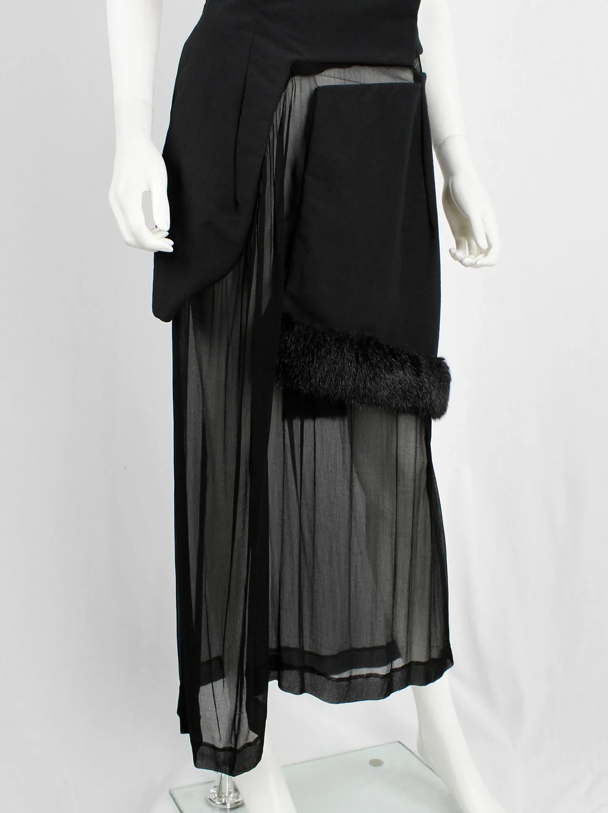 Comme des Garçons black panelled dress with faux fur trim on a sheer underlayer — fall 1997