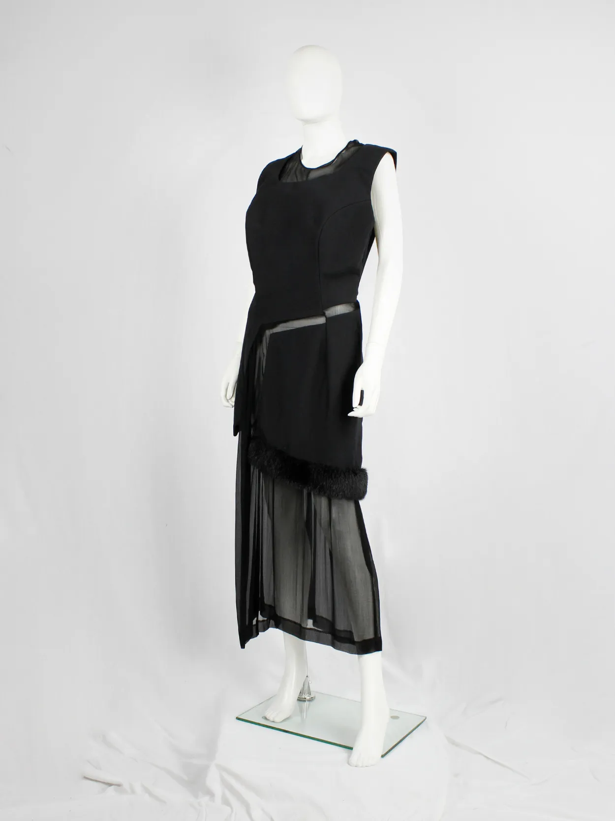 Comme des Garçons black panelled dress with faux fur trim on a sheer underlayer — fall 1997